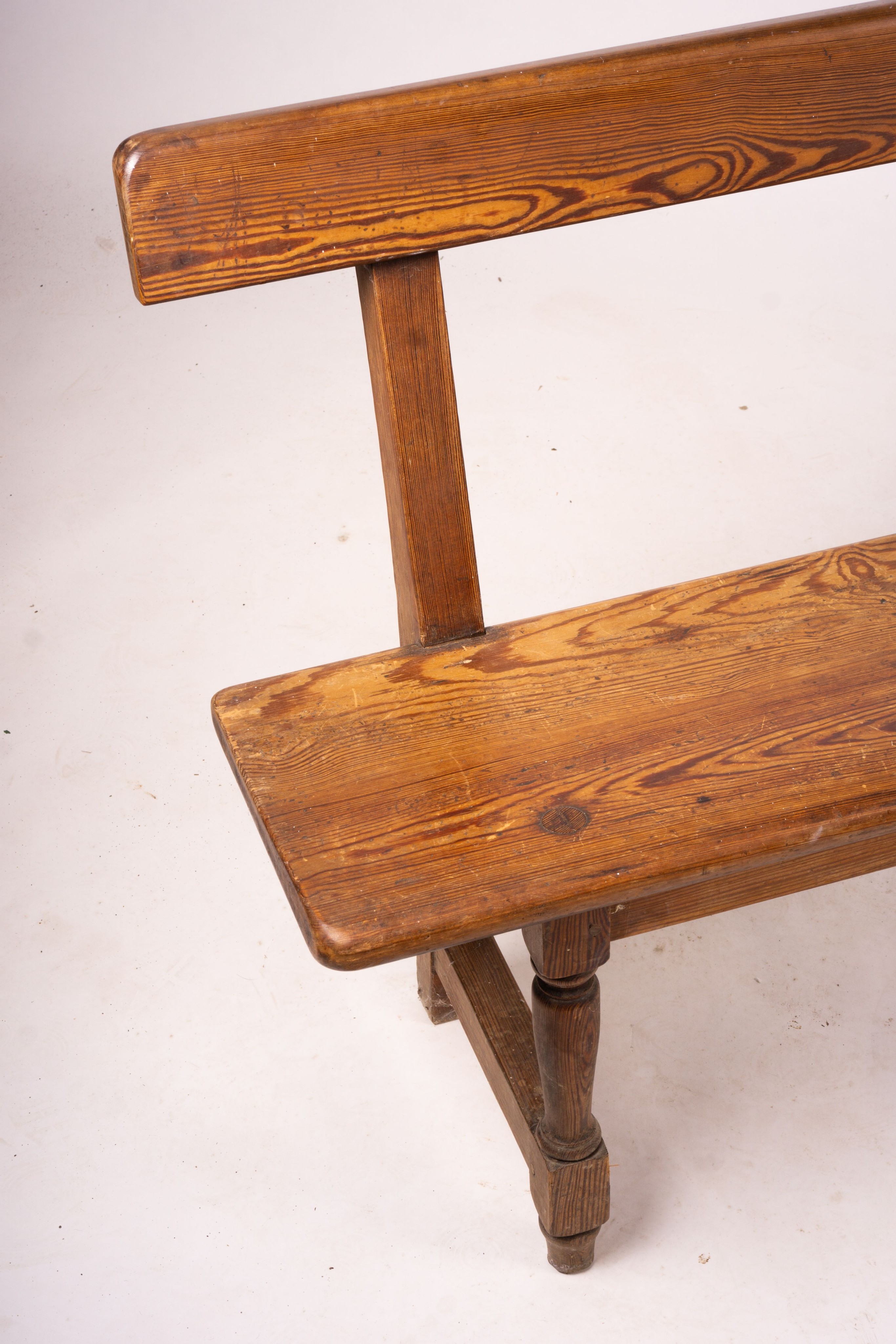 A Victorian pitch pine bench seat, W.214cm H.79cm